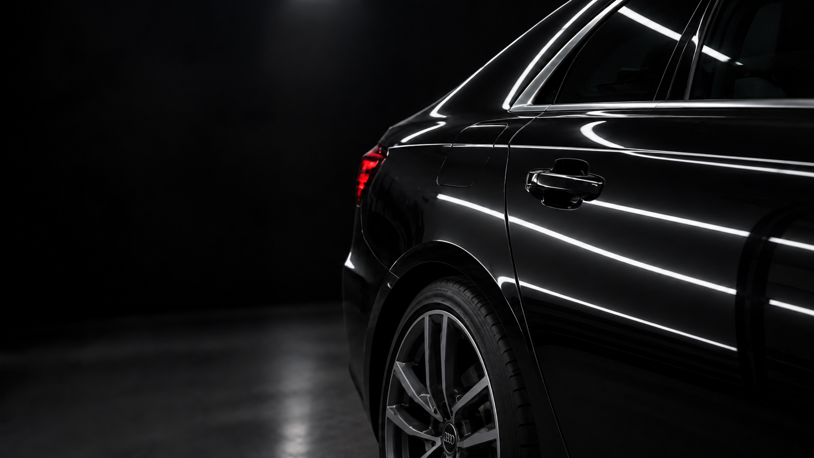 Dent-free black Audi A6 C8 under precision inspection lighting